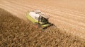 Aerial view combine harvester harvesting on corn field. Mechanized harvesting corn Royalty Free Stock Photo