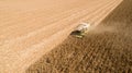 Aerial view combine, harvester harvesting on corn field. Mechanized harvesting corn Royalty Free Stock Photo