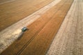 Aerial view of combine harvester working during harvesting season on large ripe wheat field. Agriculture concept Royalty Free Stock Photo