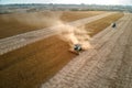 Aerial view of combine harvester working during harvesting season on large ripe wheat field. Agriculture concept Royalty Free Stock Photo