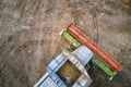 Aerial view of combine harvester working during harvesting season on large ripe wheat field. Agriculture concept Royalty Free Stock Photo