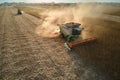 Aerial view of combine harvester working during harvesting season on large ripe wheat field. Agriculture concept Royalty Free Stock Photo