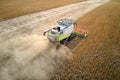 Aerial view of combine harvester working during harvesting season on large ripe wheat field. Agriculture concept Royalty Free Stock Photo