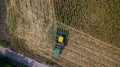 Aerial view Combine harvesters are working in Corn fields