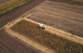 Aerial view of combine harvesting corn field Royalty Free Stock Photo