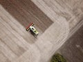 Aerial view on Combine harvesting genetically modified soya bean