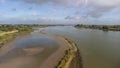 aerial view commercial ship crossing the River Rhine in an area of the Netherlands Royalty Free Stock Photo