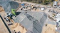 Aerial view of concrete and cement mortar plant. Concrete mixing silo for stone and sand. Bulk material storage site Royalty Free Stock Photo