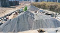 Aerial view of concrete and cement mortar plant. Concrete mixing silo for stone and sand. Bulk material storage site Royalty Free Stock Photo