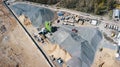 Aerial view of concrete and cement mortar plant. Concrete mixing silo for stone and sand. Bulk material storage site Royalty Free Stock Photo