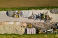 Aerial view of concrete and cement mortar plant. Concrete mixing silo for stone and sand. Bulk material storage site. Industrial Royalty Free Stock Photo