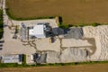 Aerial view of concrete and cement mortar plant. Concrete mixing silo for stone and sand. Bulk material storage site. Industrial Royalty Free Stock Photo