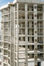 Aerial view of concrete frame of tall apartment building under construction in a city Royalty Free Stock Photo