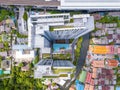 Aerial view of a condominium with swimming pool and sky garden. Top of high rise residential architecture building in urban city, Royalty Free Stock Photo