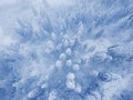 Flight over snowstorm in a snowy mountain coniferous forest, uncomfortable unfriendly winter weather. Royalty Free Stock Photo