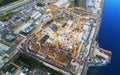 Aerial view of a Construction crane tower. Top view Crane and building working progress. Worker. Construction Site view by drone. Royalty Free Stock Photo