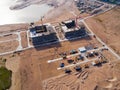 Aerial view of a Construction crane tower. Top view Crane and building working progress. Worker. Construction Site view by drone. Royalty Free Stock Photo