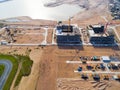 Aerial view of a Construction crane tower. Top view Crane and building working progress. Worker. Construction Site view by drone. Royalty Free Stock Photo