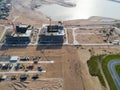 Aerial view of a Construction crane tower. Top view Crane and building working progress. Worker. Construction Site view by drone. Royalty Free Stock Photo