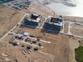 Aerial view of a Construction crane tower. Top view Crane and building working progress. Worker. Construction Site view by drone. Royalty Free Stock Photo