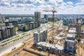 Aerial view of construction site of new residential area with tower cranes Royalty Free Stock Photo