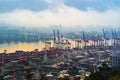 Aerial view of container cargo ship in the export and import business and logistics international goods in urban city. Shipping to