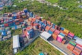 Aerial view of container cargo ship in the export and import business and logistics international goods in urban city. Shipping to