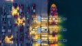 Aerial view container cargo ship at night, import export commerce global business logistic and transportation of International by Royalty Free Stock Photo