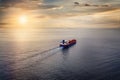 Aerial view of a container ship sailing into the sunset Royalty Free Stock Photo