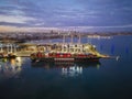 Aerial view of container ship arriving at Port of Melbourne at sunset