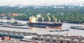 Aerial view of container ship, cargo ship and local boat on Chao Phraya River near Bangkok Port, Thailand