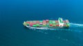 Aerial view container ship carrying container for import and export, business logistic and freight transportation by ship in open