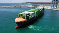 Aerial view of the container ship JSP Rover, maneuvering in the port of Alicante.