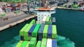 Aerial view of the container ship JSP Rover, maneuvering in the port of Alicante.