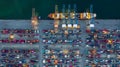 Aerial view container ship loaded in container terminal at night, Global business import export logistic and transportation, Royalty Free Stock Photo