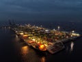 Aerial view of Container ship loading and unloading in deep sea port, logistic import and export freight transportation by Royalty Free Stock Photo