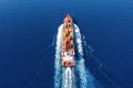 Aerial view of a container ship in motion over the open ocean Royalty Free Stock Photo