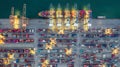 Aerial view container ship working at night terminal dock seaport, Global business company import export logistic transportation Royalty Free Stock Photo