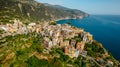 Aerial view of Corniglia and coastline of Cinque Terre,Italy.UNESCO Heritage Site.Picturesque colorful village on rock above sea.