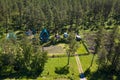 Aerial view of a country house with a garden and greenhouses surrounded by fresh air and natural green trees near Mountains in Royalty Free Stock Photo