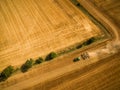 Aerial view of a country road amid fields Royalty Free Stock Photo