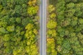 Aerial view of country road through the green summer forest in Autumn, Broken Bow, Oklahoma.