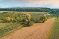 Arable field and brook on a summer sunny day. Aerial view. Royalty Free Stock Photo