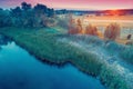 Aerial view of countryside and brook in the evening