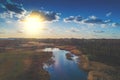 Aerial view of countryside and brook in evening