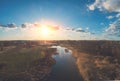 Aerial view of countryside and brook in the evening