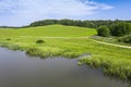 Aerial view of countryside. green field with forest and river on a sunny day Royalty Free Stock Photo