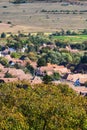 Aerial view of the countryside and house roofs, fields, and houses in Romania, with green trees Royalty Free Stock Photo