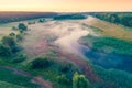 Aerial view of countryside and river in early misty morning Royalty Free Stock Photo