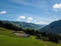 Aerial view on cozy hut with mountain panorama from Hinterglemm to Saalbach in the Alps in Austria. on a sunny summer Royalty Free Stock Photo
